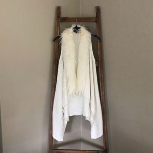 White sweater vest with faux fur